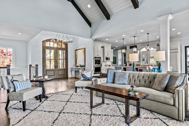 1611 Lighthouse Cir, Greensboro, GA 30642 - living area with high vaulted ceiling, beam ceiling, french doors, a chandelier, and light wood-type flooring