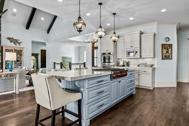 1611 Lighthouse Cir, Greensboro, GA 30642 - kitchen featuring lofted ceiling with beams, dark wood finished floors, a center island, appliances with stainless steel finishes, and backsplash