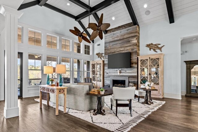 1611 Lighthouse Cir, Greensboro, GA 30642 - living area featuring ornate columns, a fireplace, wood finished floors, and ceiling fan