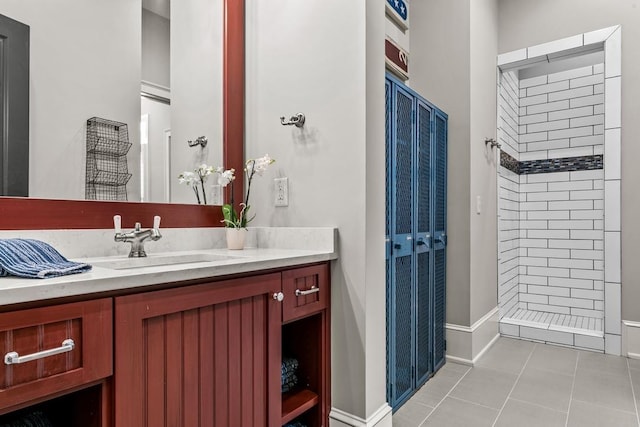 1611 Lighthouse Cir, Greensboro, GA 30642 - bathroom featuring baseboards, tiled shower, tile patterned flooring, and vanity