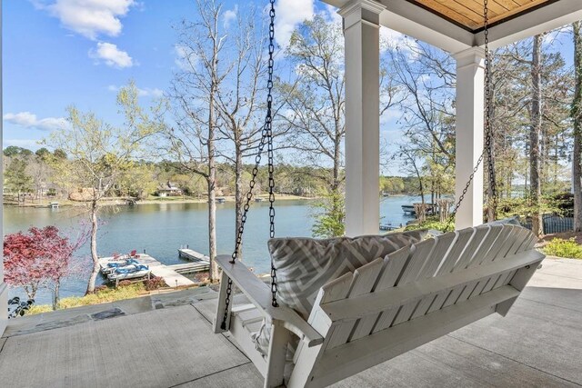 1611 Lighthouse Cir, Greensboro, GA 30642 - view of patio / terrace with a water view and a boat dock