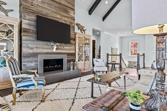 1611 Lighthouse Cir, Greensboro, GA 30642 - living area with high vaulted ceiling, wooden ceiling, beam ceiling, a fireplace, and wood finished floors