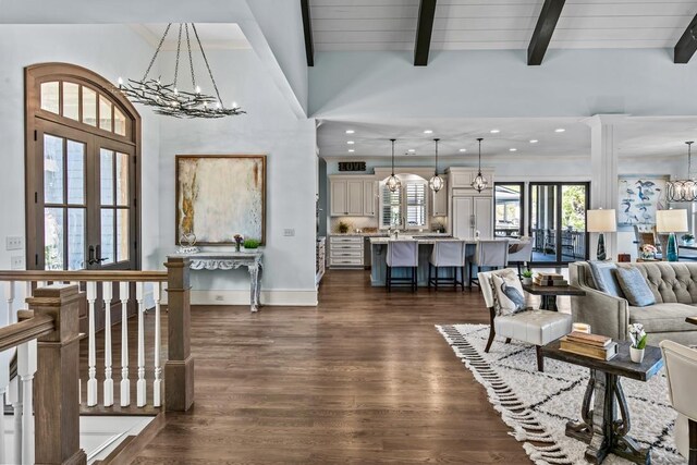 1611 Lighthouse Cir, Greensboro, GA 30642 - living room featuring recessed lighting, french doors, a chandelier, beam ceiling, and dark wood-style floors