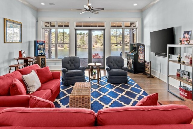 1611 Lighthouse Cir, Greensboro, GA 30642 - living area featuring a wealth of natural light, wood finished floors, and crown molding