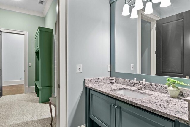 1611 Lighthouse Cir, Greensboro, GA 30642 - bathroom featuring vanity, baseboards, visible vents, and crown molding