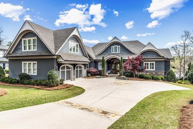1611 Lighthouse Cir, Greensboro, GA 30642 - shingle-style home featuring a front yard, concrete driveway, and an attached garage