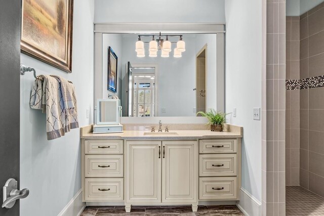 1611 Lighthouse Cir, Greensboro, GA 30642 - bathroom with vanity, baseboards, and tiled shower