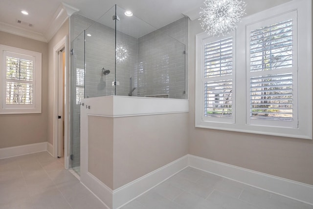 bathroom with baseboards, tile patterned flooring, crown molding, a shower stall, and a notable chandelier