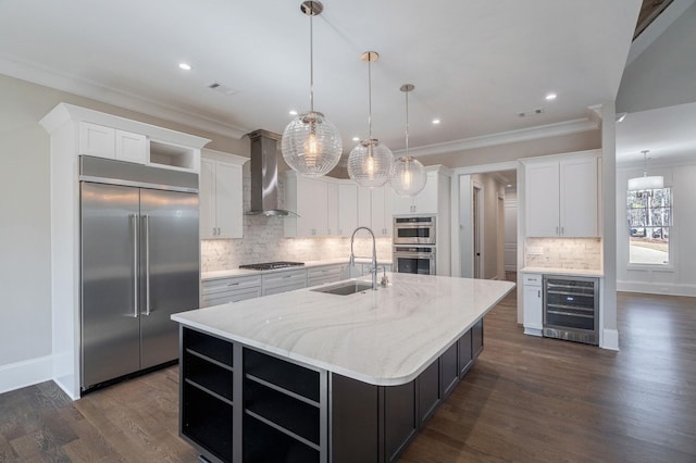 kitchen featuring wine cooler, appliances with stainless steel finishes, wall chimney range hood, open shelves, and a sink