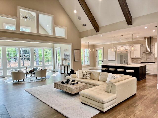 1180 Maple Ridge Way, Greensboro, GA 30642 - living room featuring visible vents, a fireplace, recessed lighting, wood finished floors, and high vaulted ceiling