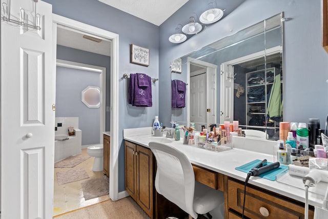 bathroom with toilet and vanity