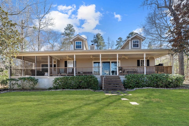 farmhouse-style home with a front lawn, a sunroom, and ceiling fan