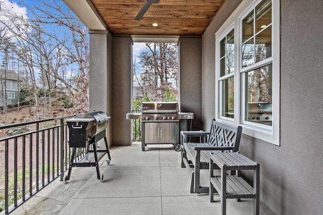 balcony with ceiling fan and a grill