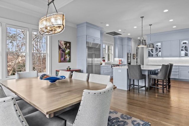 dining area with dark hardwood / wood-style floors and sink