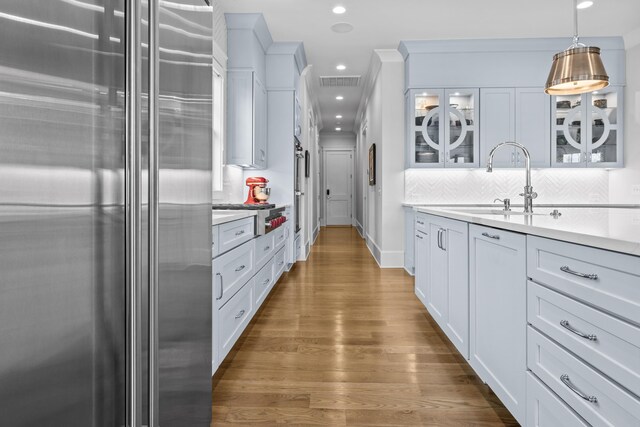 kitchen featuring stainless steel appliances and white cabinets