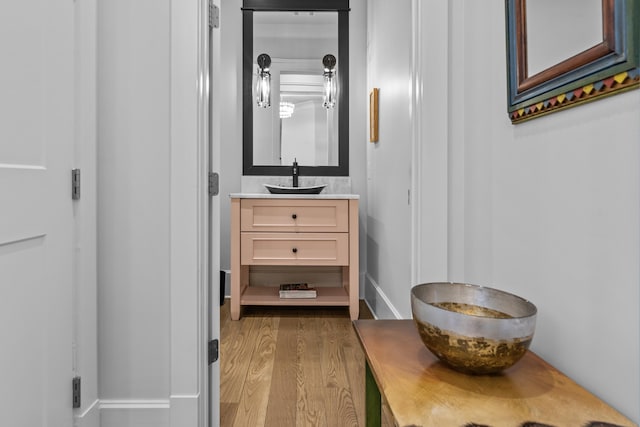 bathroom featuring vanity and hardwood / wood-style flooring