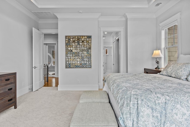 bedroom with light colored carpet and ornamental molding