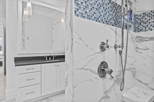 bathroom with vanity and tiled shower