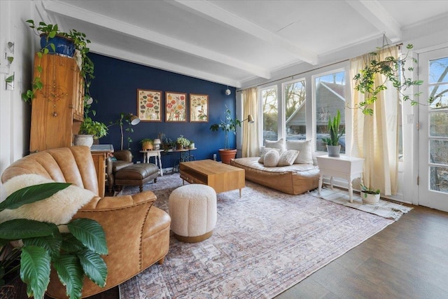 sunroom / solarium featuring vaulted ceiling with beams and a wealth of natural light