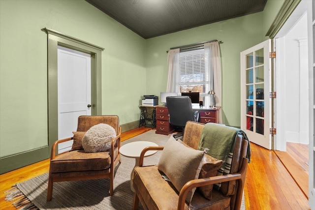 living area with light hardwood / wood-style flooring