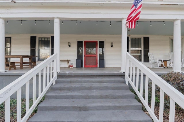 entrance to property featuring a porch