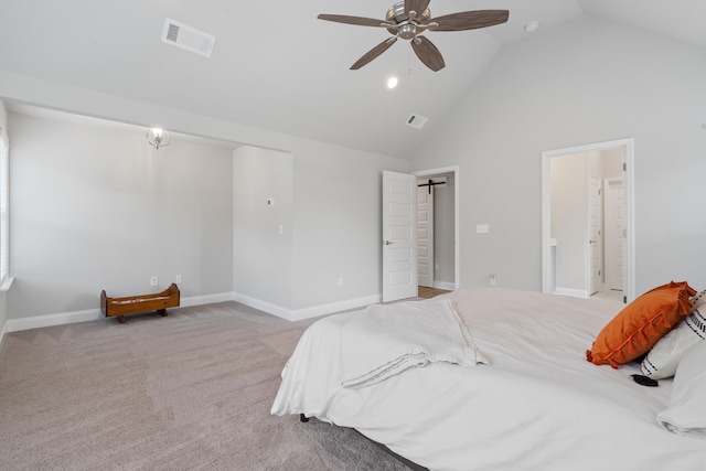 bedroom with ceiling fan, ensuite bath, high vaulted ceiling, and light carpet