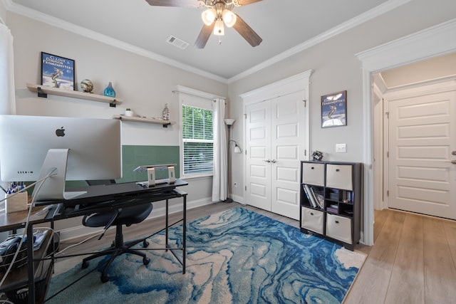 home office with crown molding, hardwood / wood-style floors, and ceiling fan