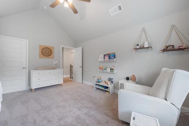 sitting room featuring high vaulted ceiling, light carpet, and ceiling fan