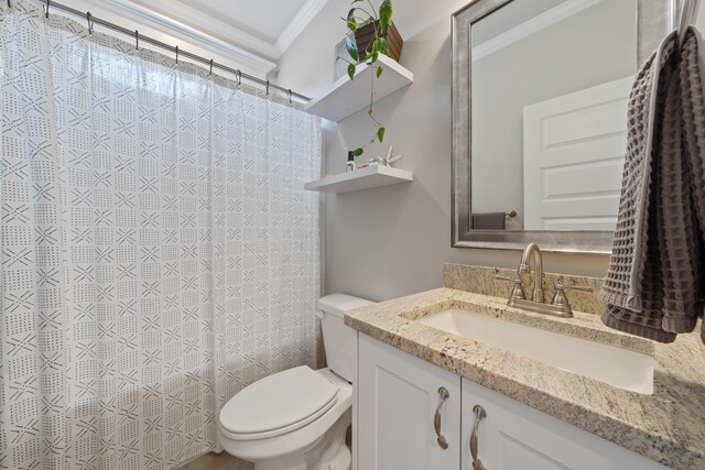 bathroom with vanity, crown molding, and toilet