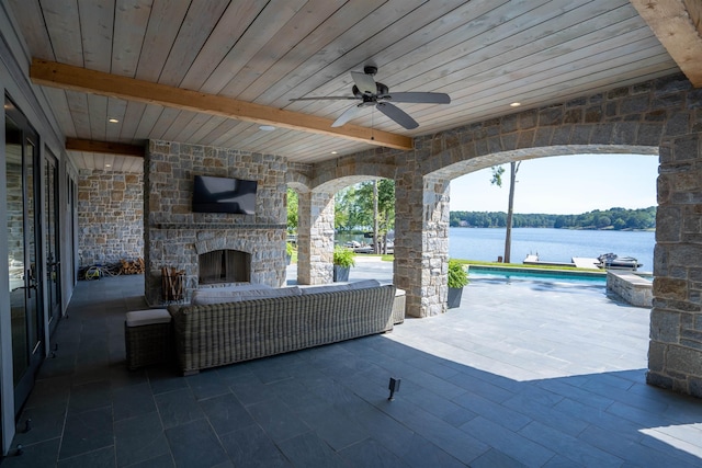 view of patio / terrace featuring an outdoor stone fireplace