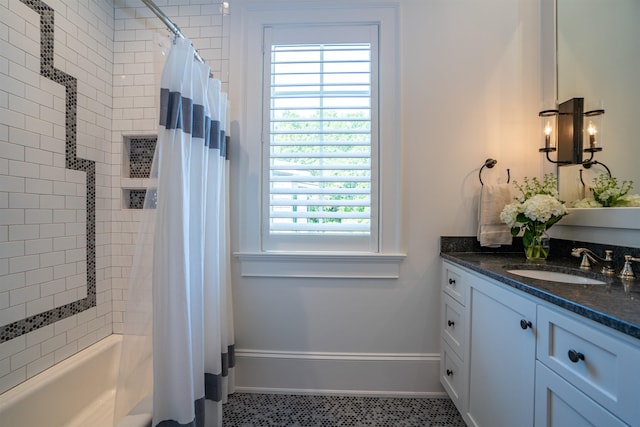 bathroom with shower / bath combination with curtain and vanity