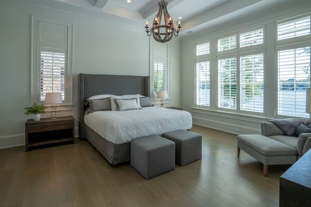 bedroom featuring hardwood / wood-style flooring and a notable chandelier