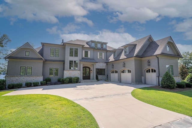 view of front of home with a garage and a front yard