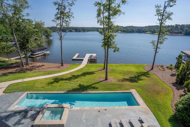 view of swimming pool with an in ground hot tub, a water view, a yard, and a boat dock