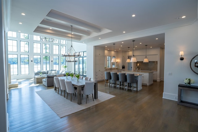 dining space featuring beamed ceiling, dark hardwood / wood-style flooring, and a chandelier