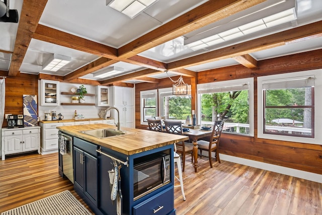 150 Possum Point Dr, Eatonton, GA 31024 - kitchen featuring a sink, wooden counters, open shelves, blue cabinets, and light wood-type flooring