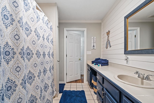 150 Possum Point Dr, Eatonton, GA 31024 - full bath with vanity, tile patterned flooring, wood walls, a shower with shower curtain, and crown molding
