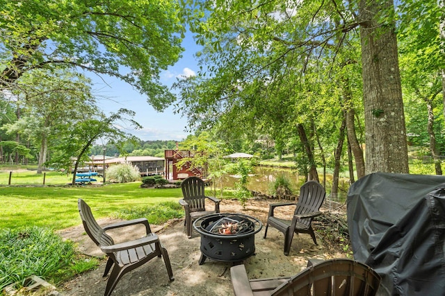 150 Possum Point Dr, Eatonton, GA 31024 - view of patio / terrace featuring a fire pit and a grill