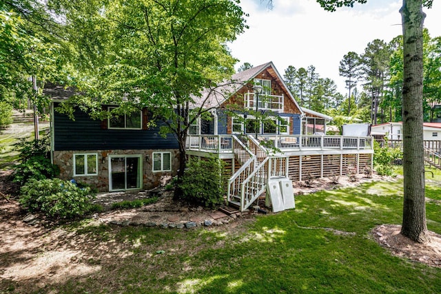 150 Possum Point Dr, Eatonton, GA 31024 - rear view of property with stairs, stone siding, a wooden deck, and a yard