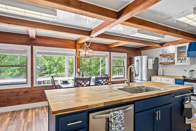 150 Possum Point Dr, Eatonton, GA 31024 - kitchen featuring butcher block countertops, blue cabinetry, stainless steel appliances, beam ceiling, and coffered ceiling