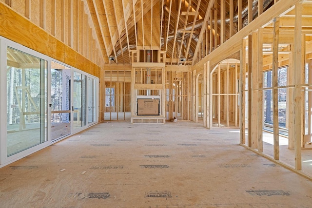 miscellaneous room with a towering ceiling