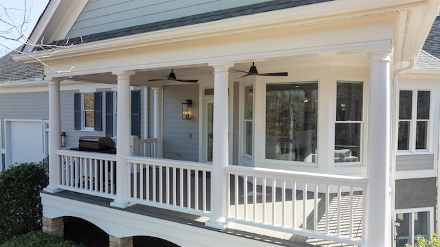 entrance to property with ceiling fan and roof with shingles