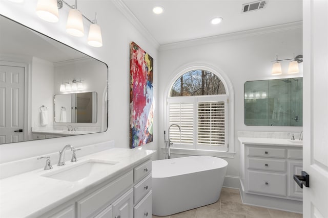 bathroom featuring two vanities, visible vents, ornamental molding, a sink, and tile patterned floors