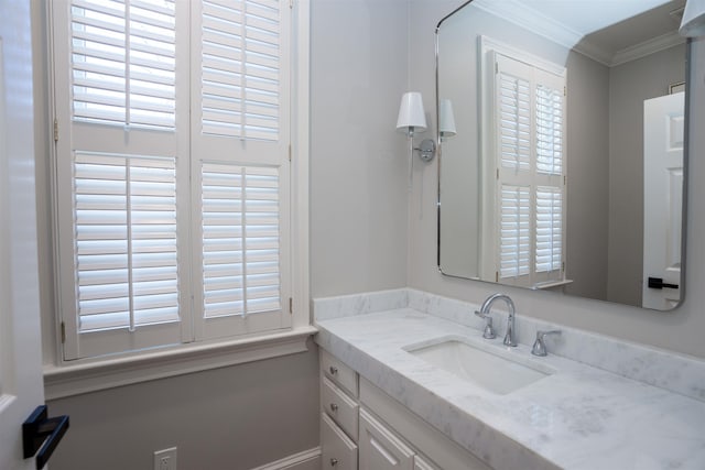 bathroom with crown molding and vanity