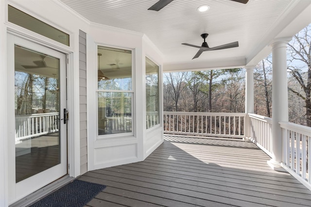 wooden terrace featuring ceiling fan