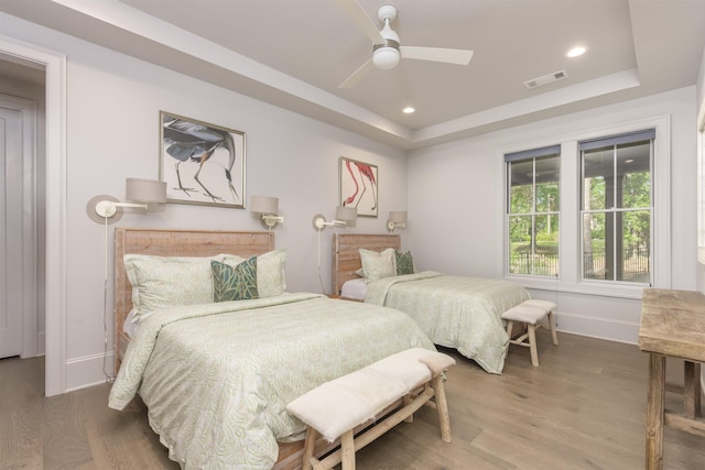 1010 Thorton Crk, Greensboro, GA 30642 - bedroom featuring a raised ceiling, wood finished floors, baseboards, recessed lighting, and ceiling fan
