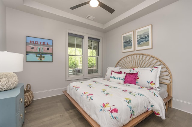 1010 Thorton Crk, Greensboro, GA 30642 - bedroom featuring wood finished floors, baseboards, a raised ceiling, and a ceiling fan