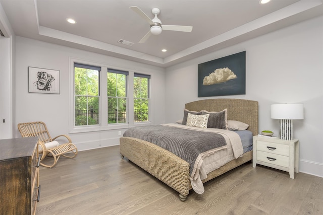 1010 Thorton Crk, Greensboro, GA 30642 - bedroom with a tray ceiling, baseboards, wood finished floors, recessed lighting, and ceiling fan