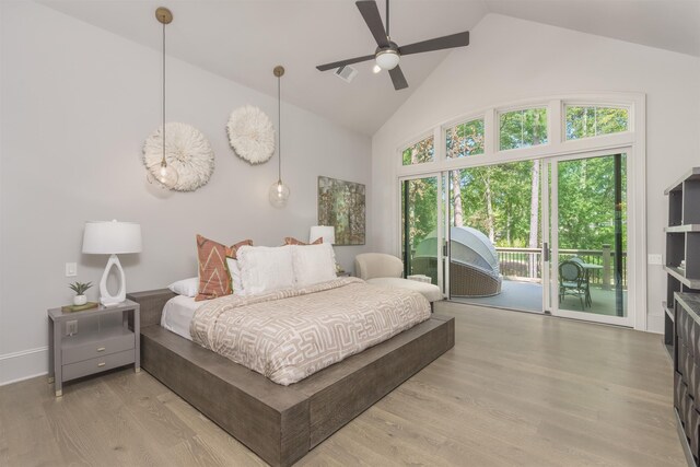 1010 Thorton Crk, Greensboro, GA 30642 - bedroom featuring access to outside, high vaulted ceiling, and wood finished floors
