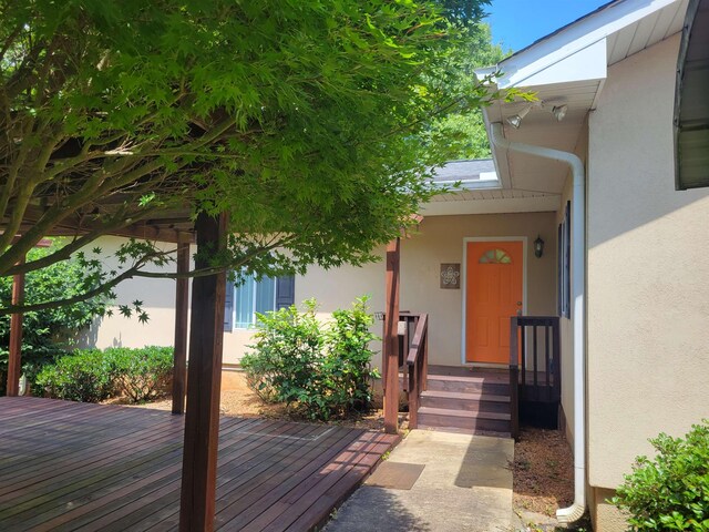 104 Wesley Ln, Eatonton, GA 31024 - ranch-style house with stucco siding, crawl space, a deck, and a front lawn